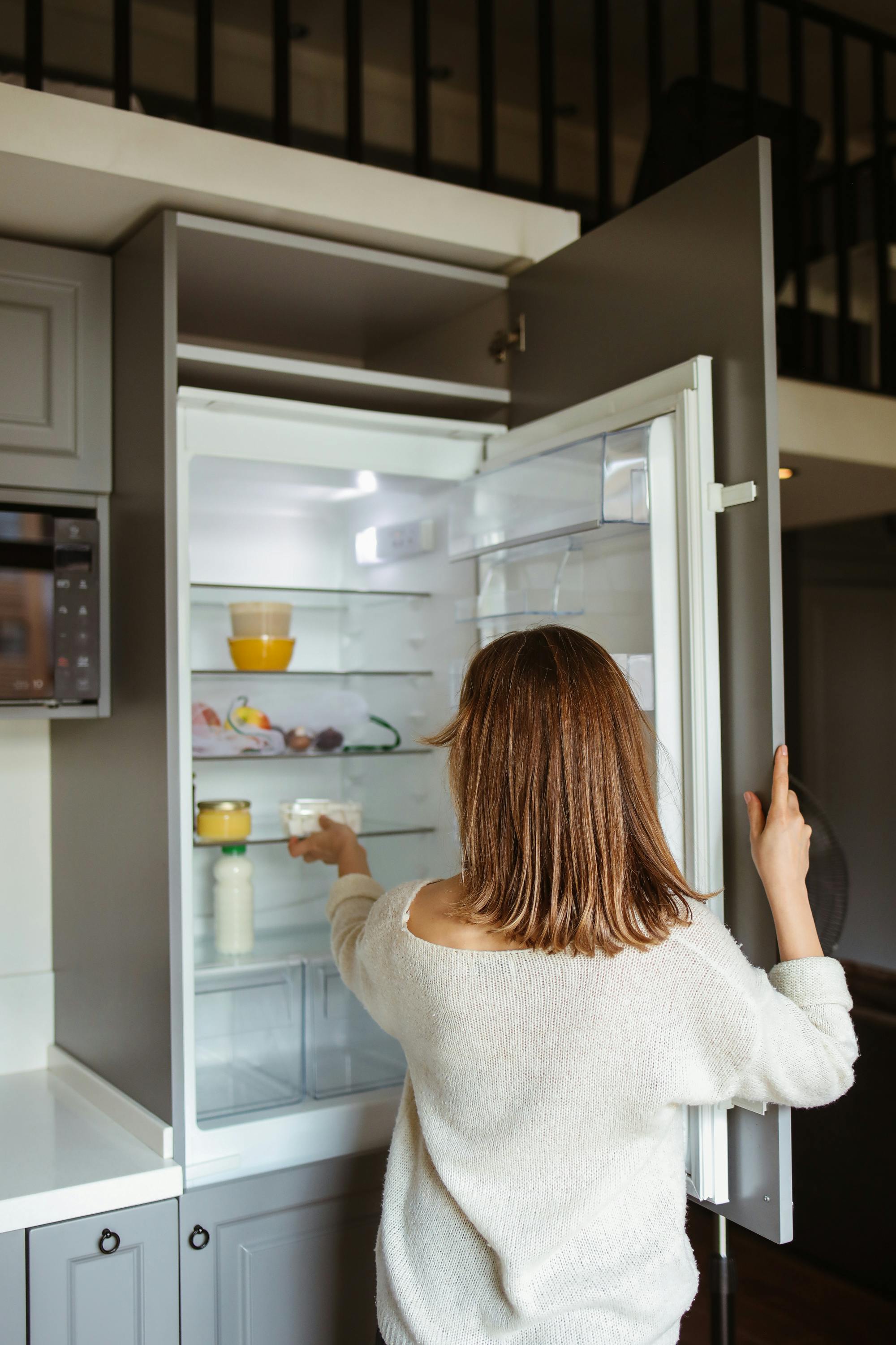 Technician fixing fridge